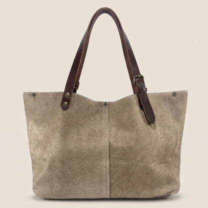 Vue du dos du cabas Brown Swiss #13/137, avec sa couture centrale et ses lanières en cuir marron.