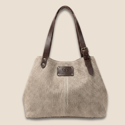 Vue de face resserrée du cabas Brown Swiss #13/137, avec sa peau beige subtilement mouchetée.